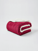 Detail shot of plush sherpa fleece fibers on Beddora throw blanket for winter comfort.