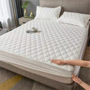 Beddora waterproof mattress protector fitted on a king mattress showing smooth breathable cotton surface and snug fit.